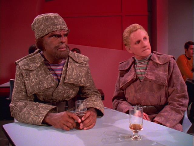 Odo and Worf in disguise as traders on Station K-7