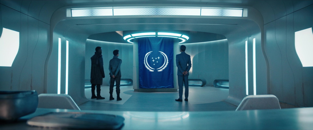 Burnham raises the flag of the Federation