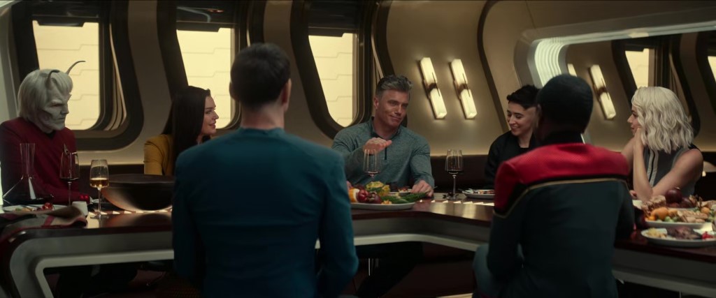 Captain Pike tells stories over dinner