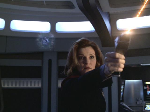 Janeway fires on the nucleogenic lifeforms